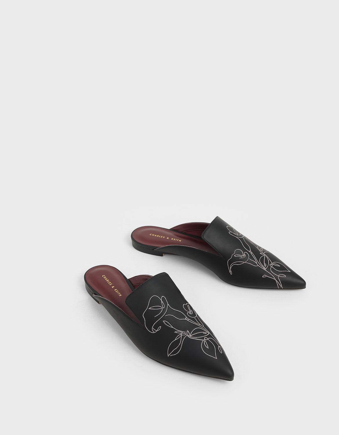 black embroidered mules