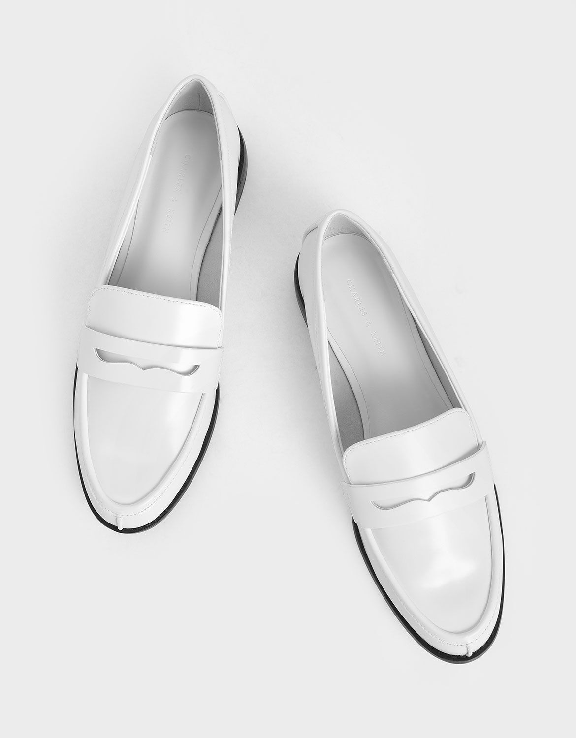 white and silver loafers