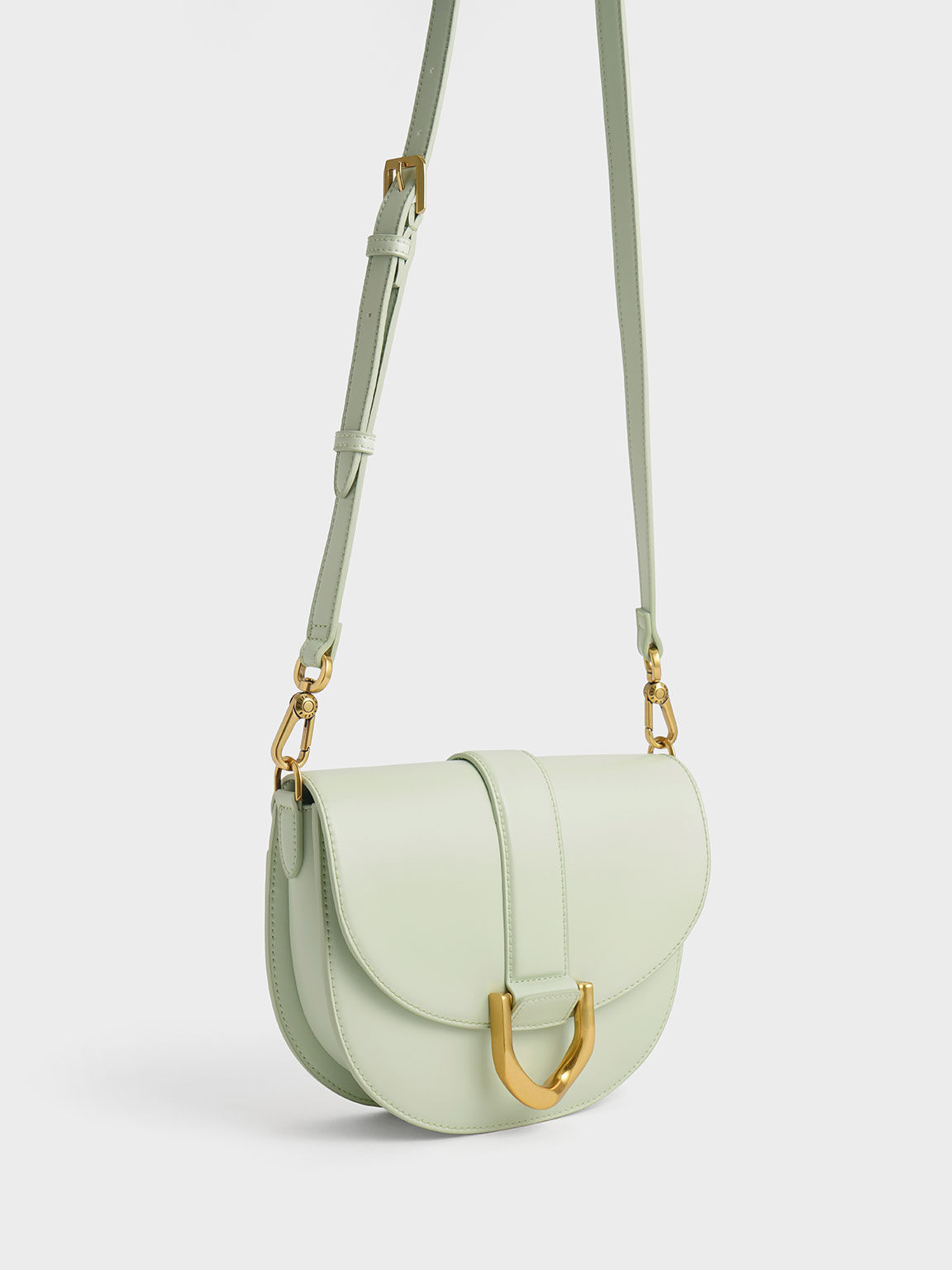 CHARLES & KEITH - Our highly popular Gabine saddle bag is back this season  in new colours, including dark green and mustard. Shop now: Gabine saddle  bag -  (Credit: Pingping, @pingvibes) #