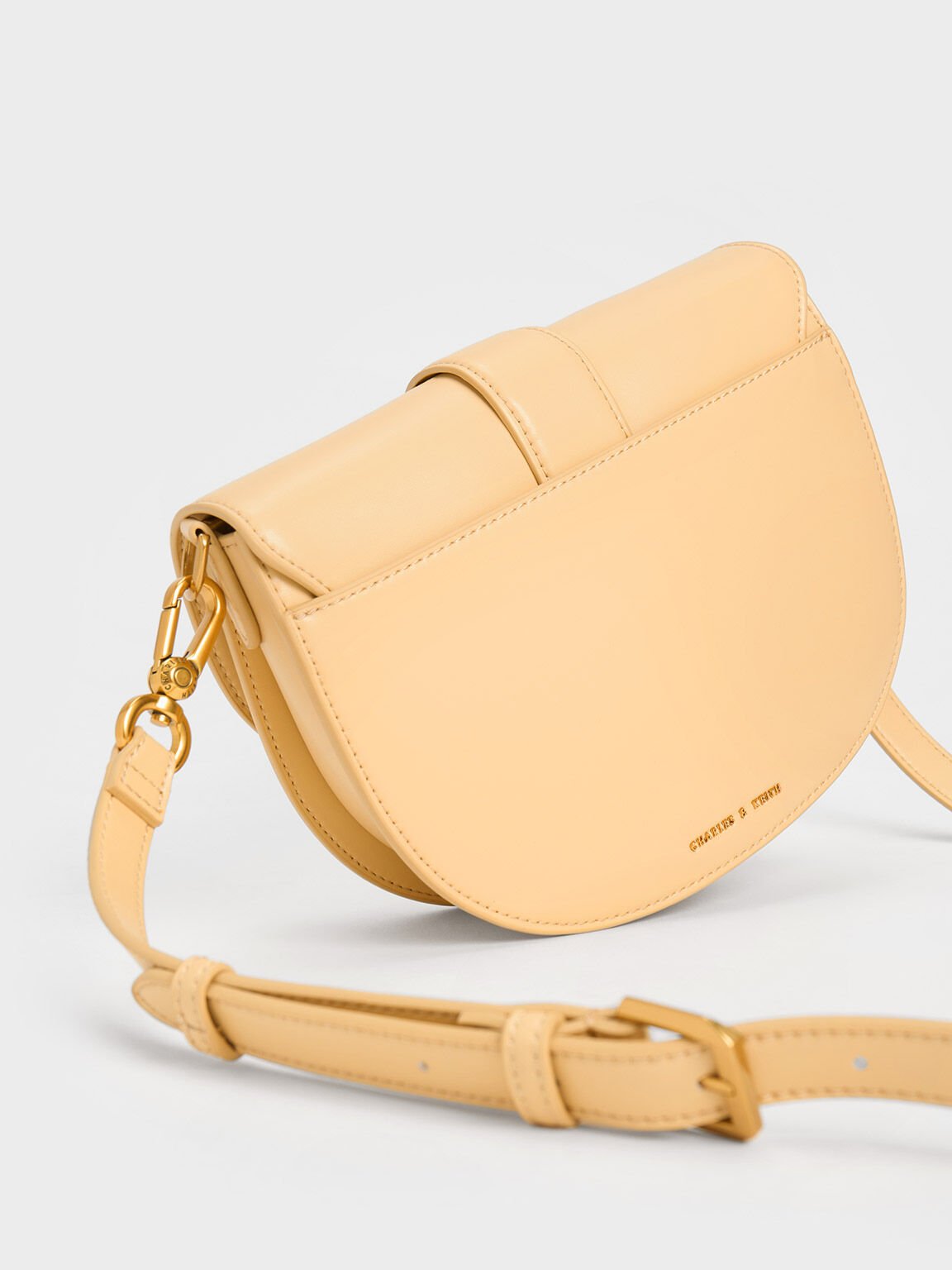 The khaki Gabine saddle bag is not only just as versatile as the black  version, but is also a little more unique. #CharlesKeithSS21…