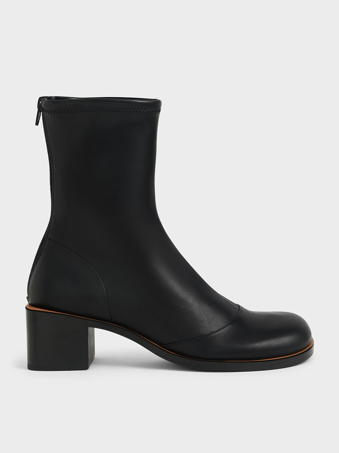 black ankle boots with white stitching