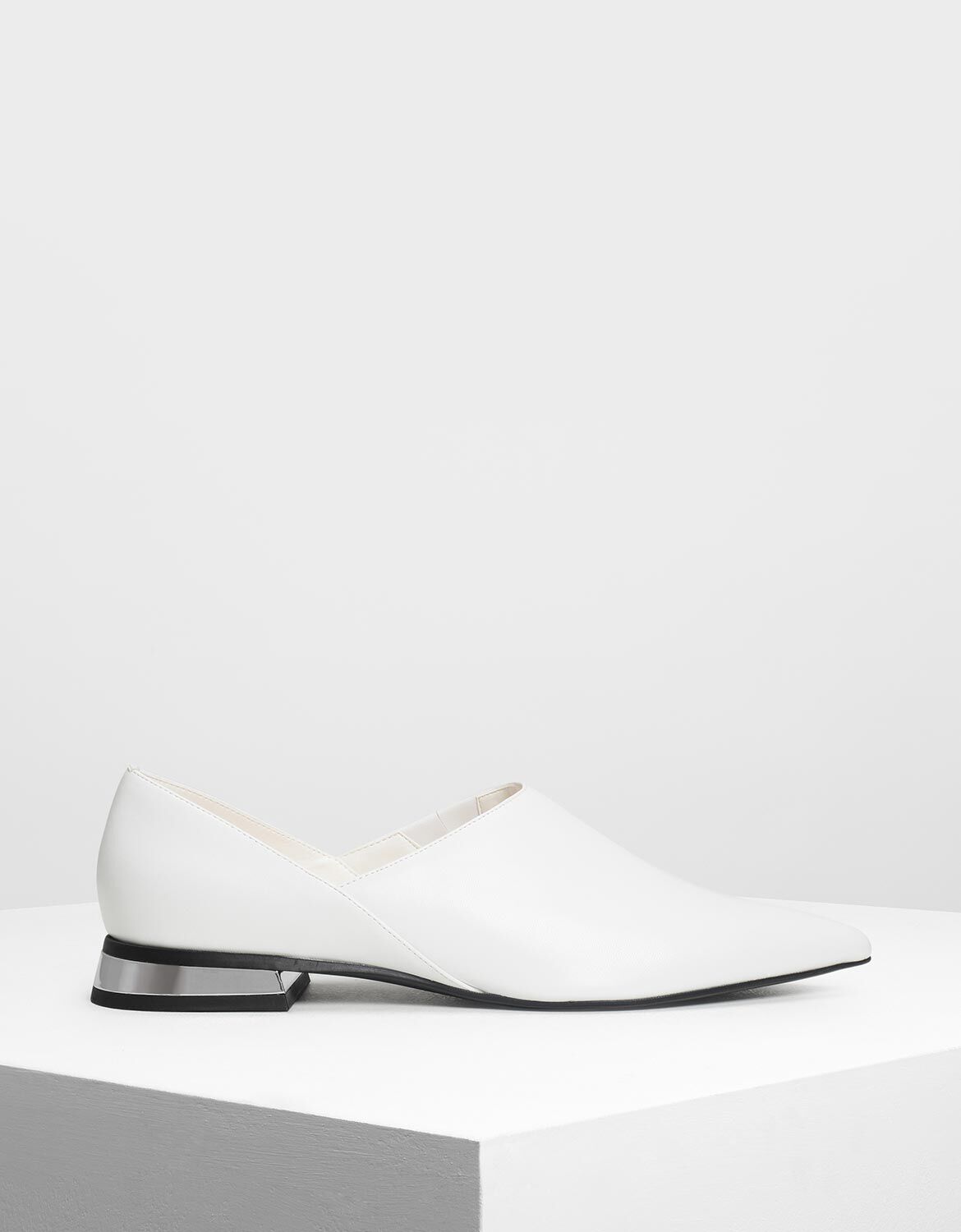 white pointed shoes