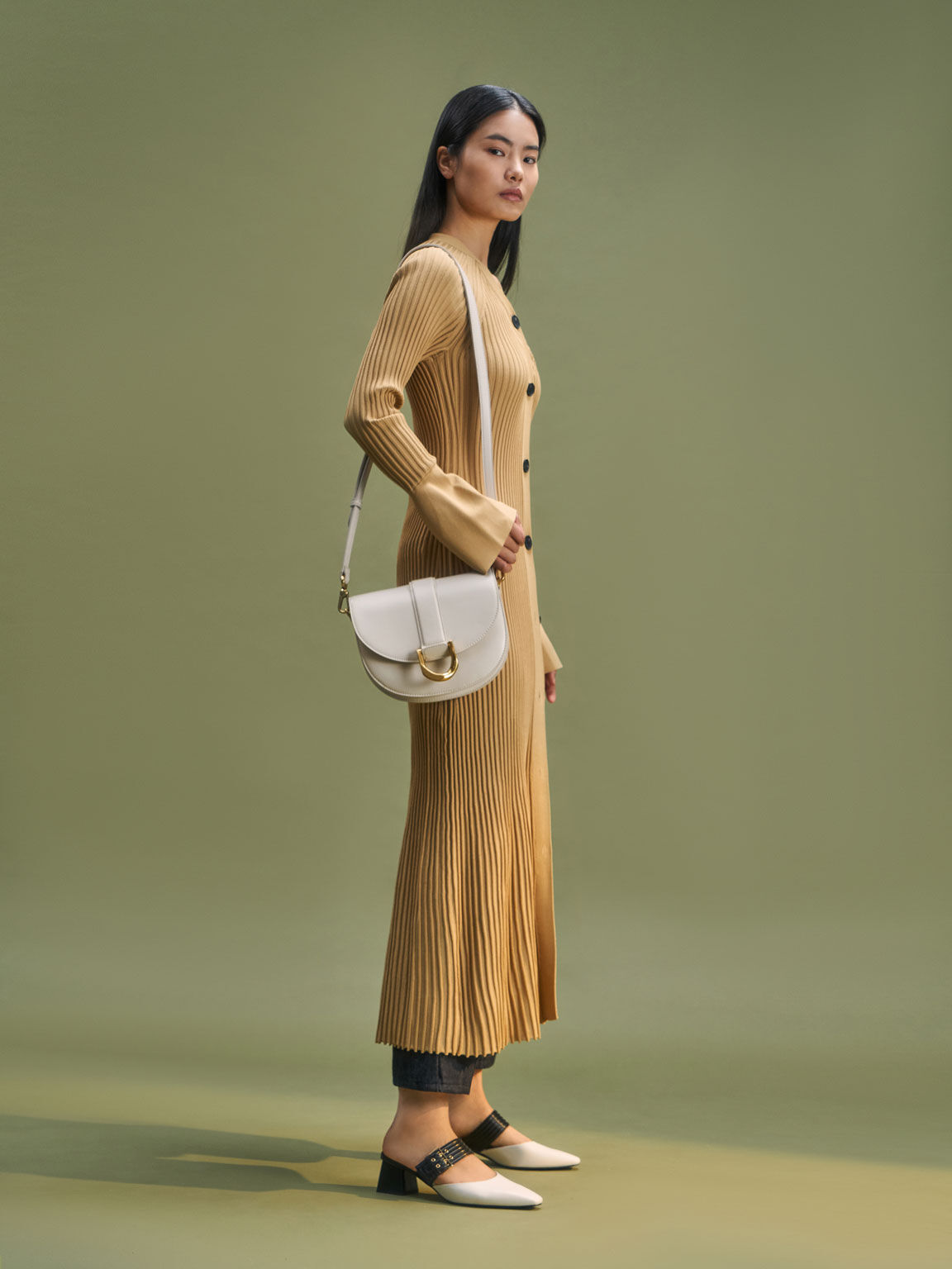 CHARLES & KEITH - Our highly popular Gabine saddle bag is back this season  in new colours, including dark green and mustard. Shop now: Gabine saddle  bag -  (Credit: Pingping, @pingvibes) #