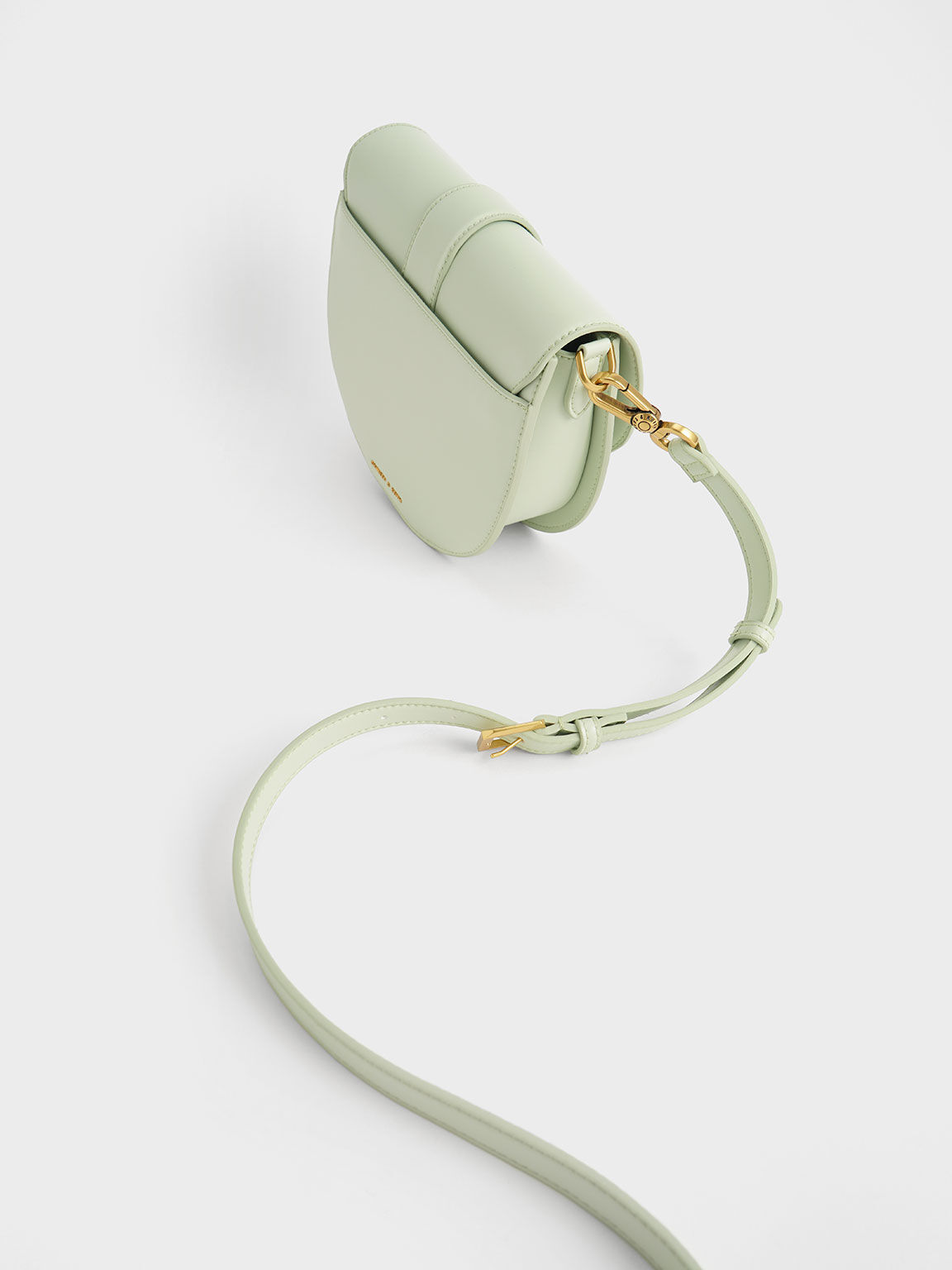 The khaki Gabine saddle bag is not only just as versatile as the black  version, but is also a little more unique. #CharlesKeithSS21…