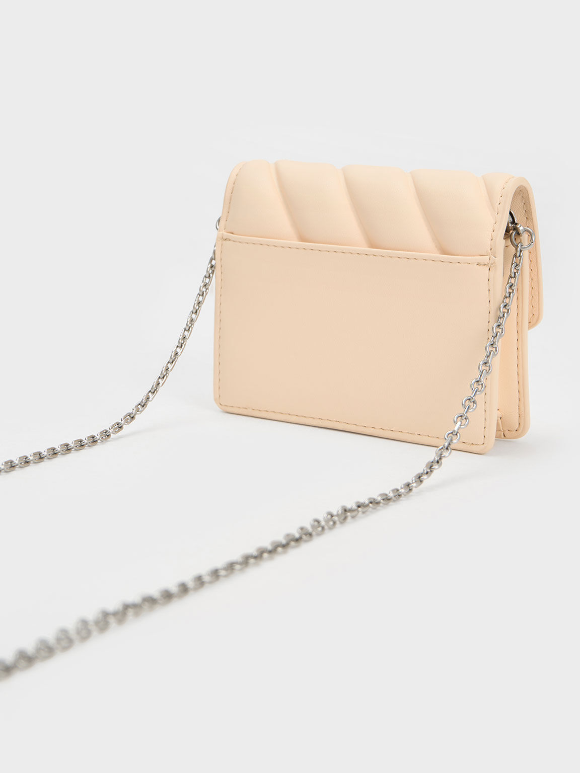 Charles & keith 2024 asymmetric front flap bag