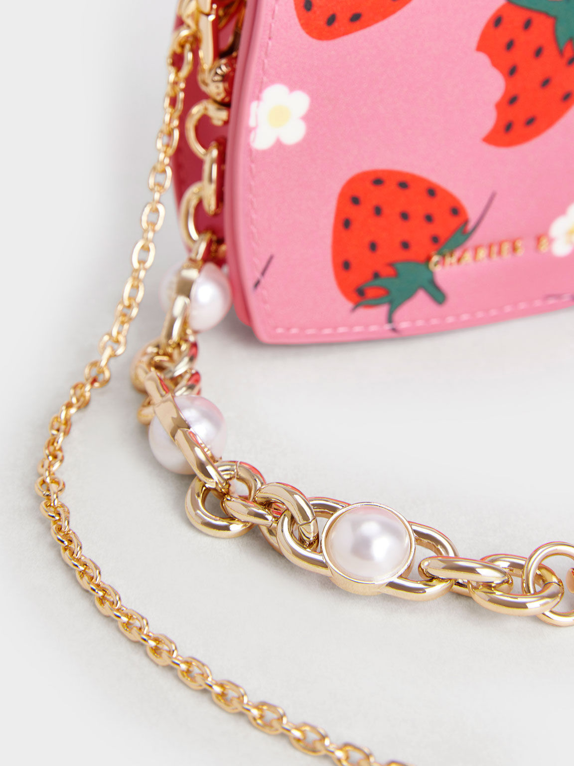 Light Pink Chain Handle Strawberry-Print Vanity Pouch | CHARLES & KEITH
