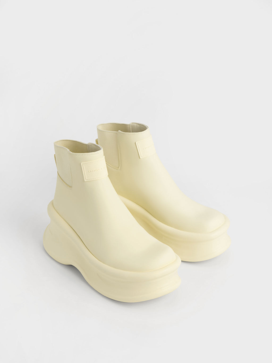 Butter Curved Platform Ankle Boots - CHARLES & KEITH SG