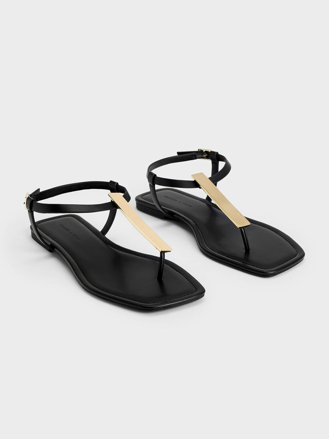 One Stud Calfskin Flat Thong Sandal for Woman in Black | Valentino US