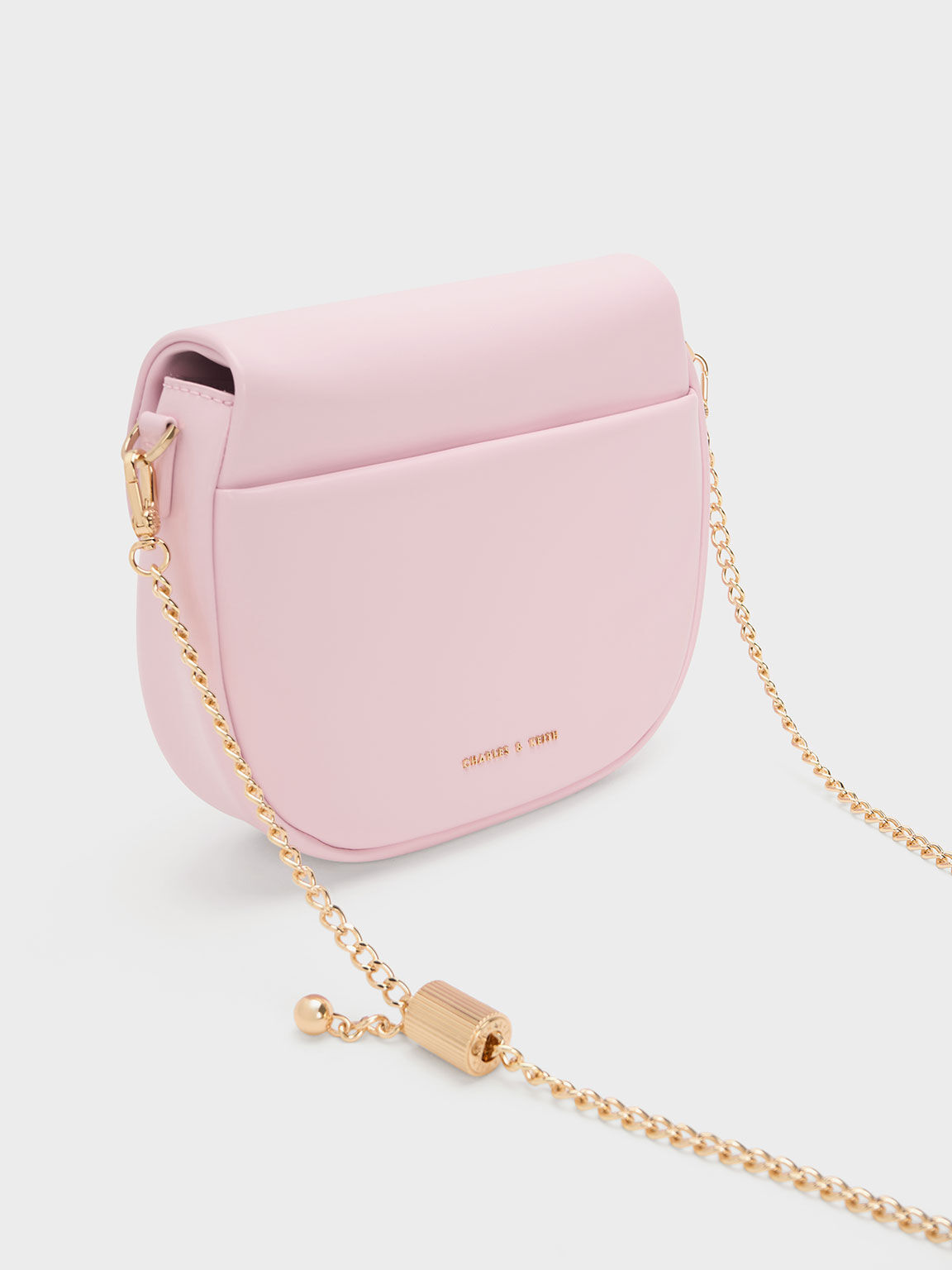 CHARLES & KEITH Small curved pink boxy sling bag