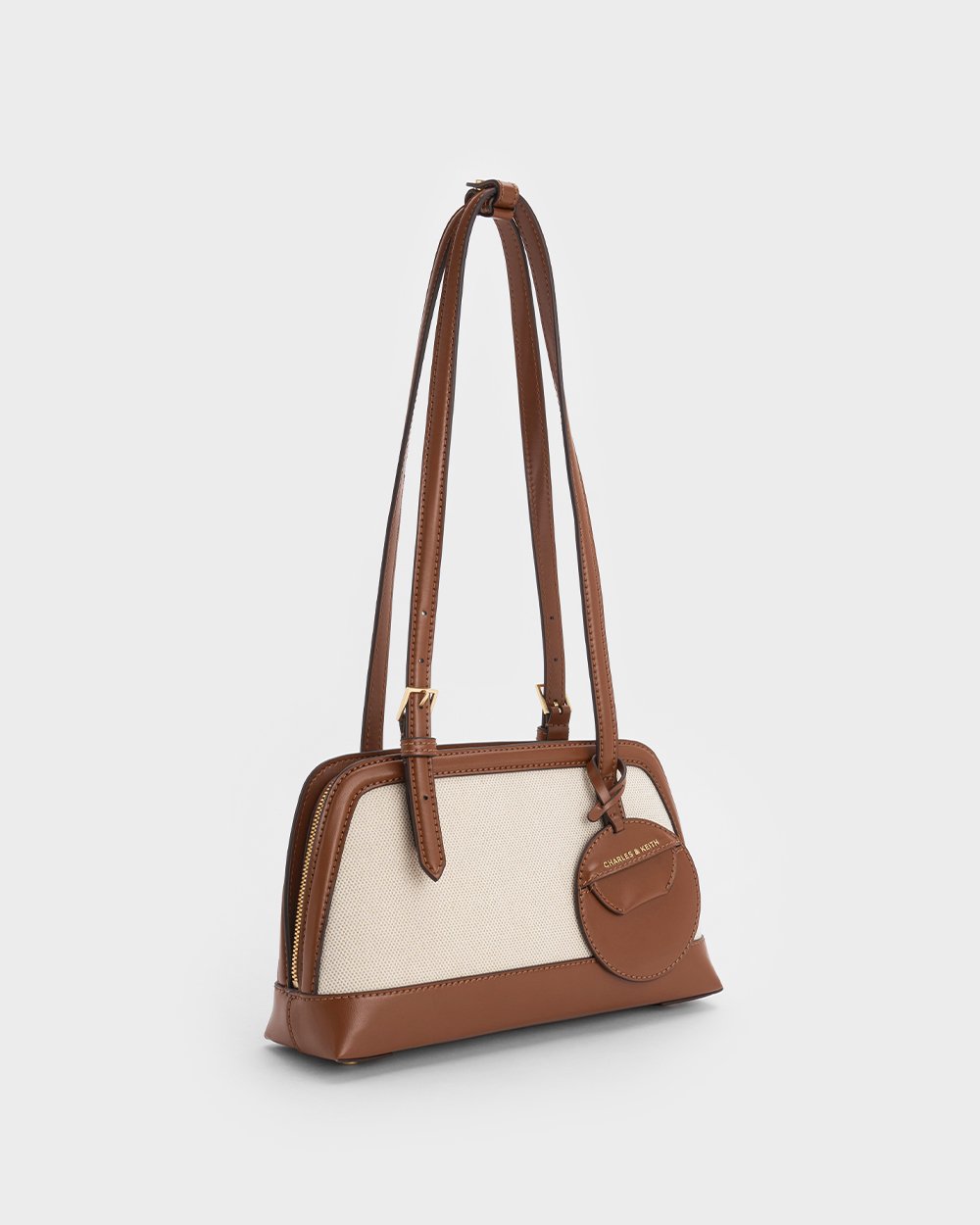 Women’s Enola Elongated-Handle Bag in black and Enola Canvas Two-Tone Elongated-Handle Bag in chocolate - CHARLES & KEITH