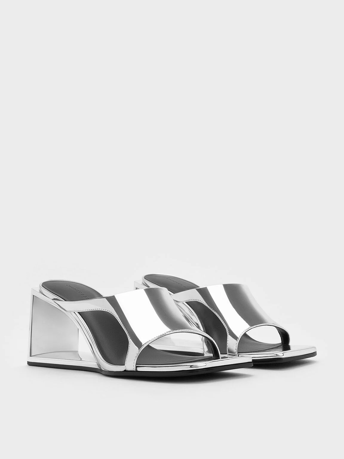 Women’s Xeli metallic triangle-heel mules in silver- CHARLES & KEITH