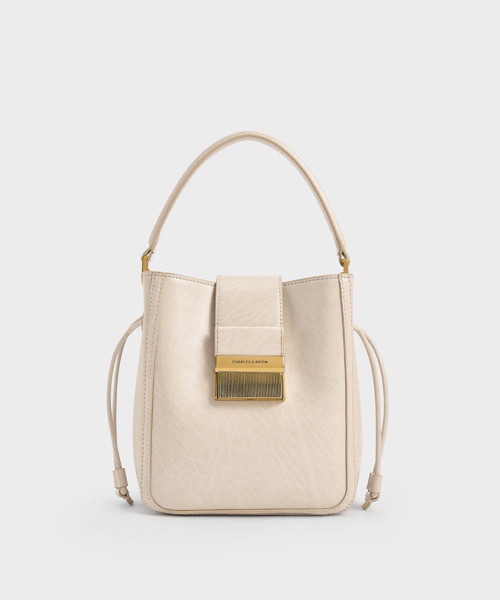 Women’s Charlot elongated bucket bag in oat – CHARLES & KEITH