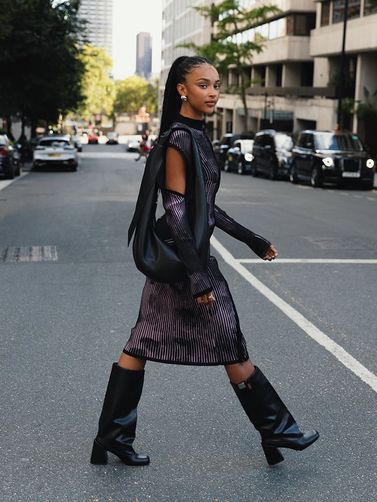 Women’s Toni knotted curved hobo bag in noir & Robbie platform knee-high boots in black, as seen on Tade - CHARLES & KEITH