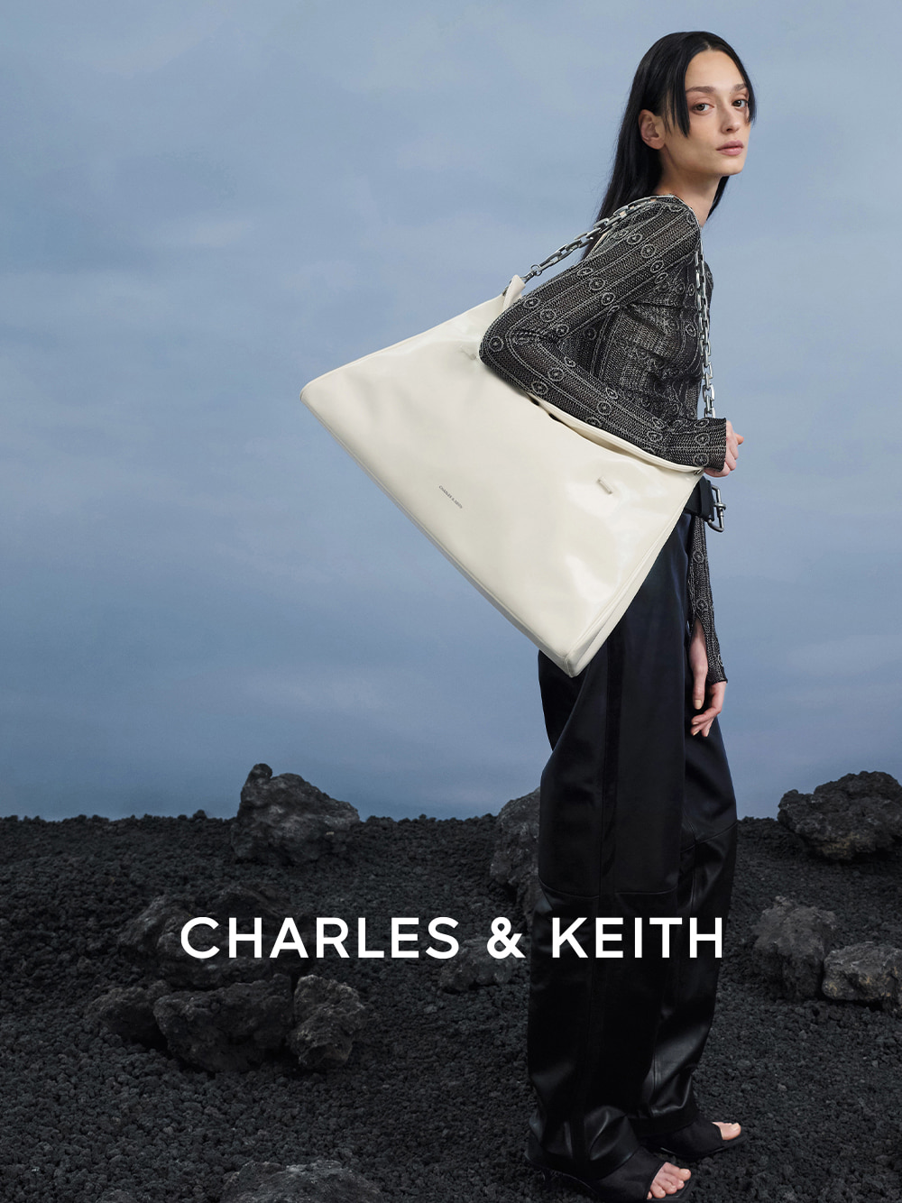 Loren Mesh Cut-Out Boot Sandals in black, Andromeda Chunky-Chain XL Trapeze Tote Bag in cream - CHARLES & KEITH