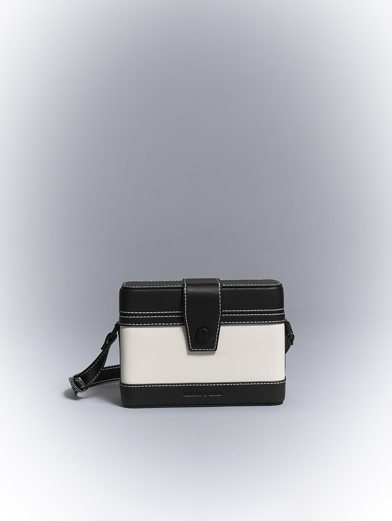 CHARLES & KEITH - Tasteful and refined, this sculptural handle