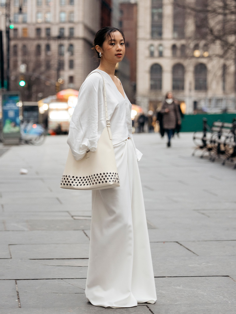 Women’s Liv grommet hobo bag in cream, as seen on Isabelle Sung – CHARLES & KEITH