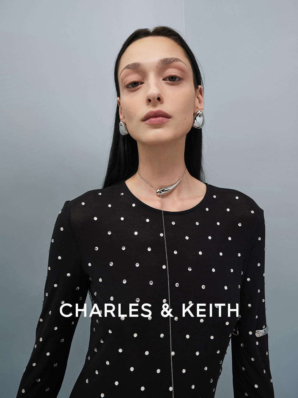 Eimear Teardrop Stud Earrings, Eimear Cuff Bangle, Eimear Sculptural Asymmetrical Necklace, all in silver - CHARLES & KEITH