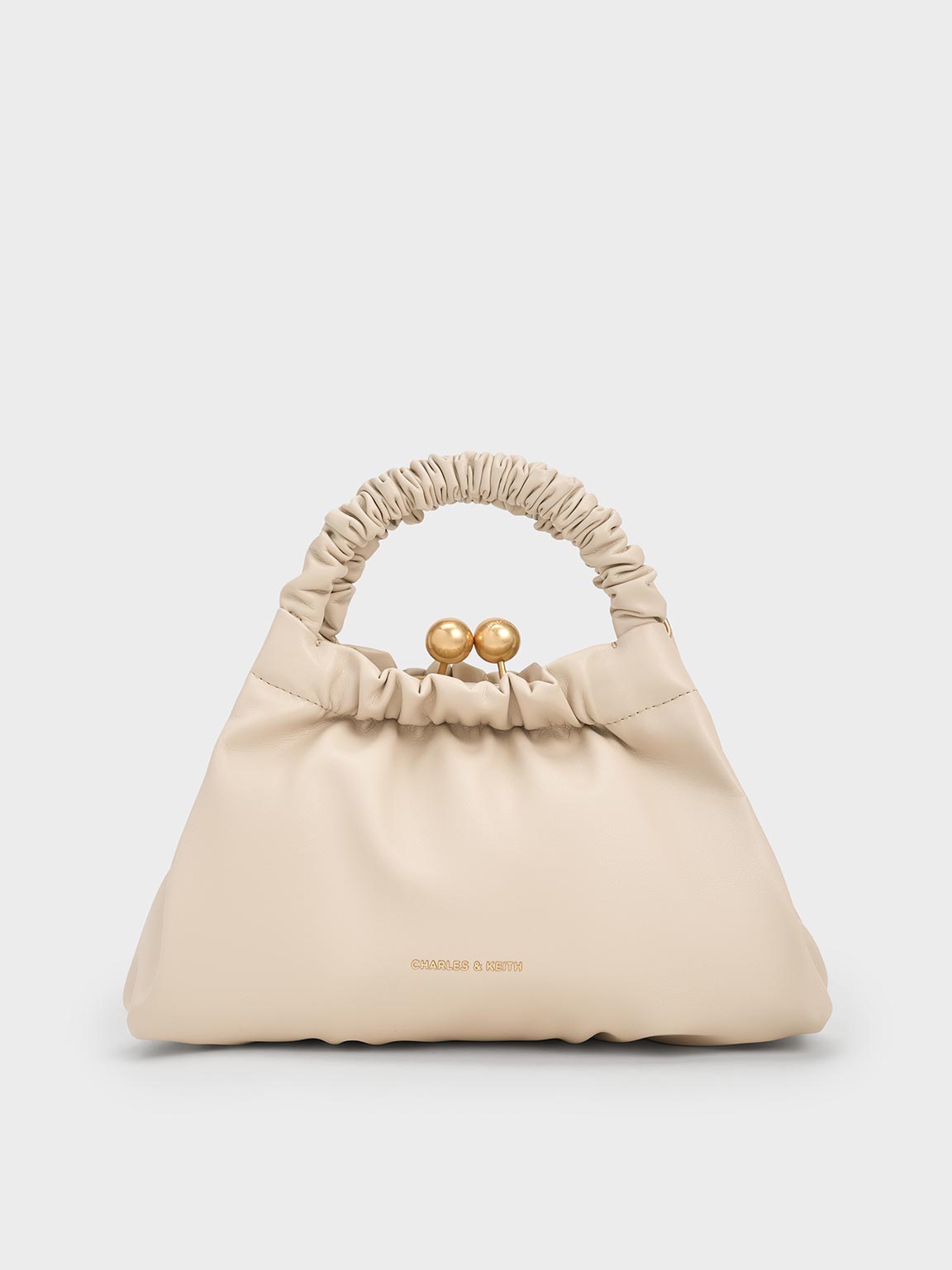 Shop Charles & Keith - Eve Ruched-handle Trapeze Bag In Beige
