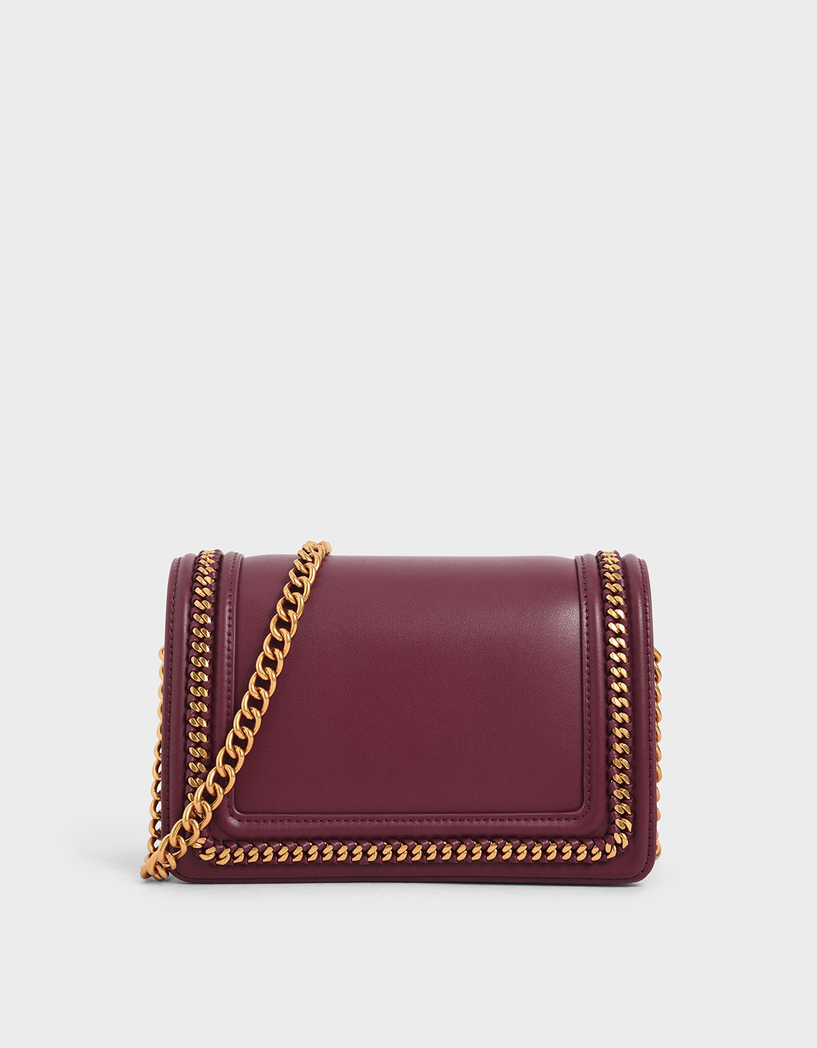 charles and keith gold chain sling bag