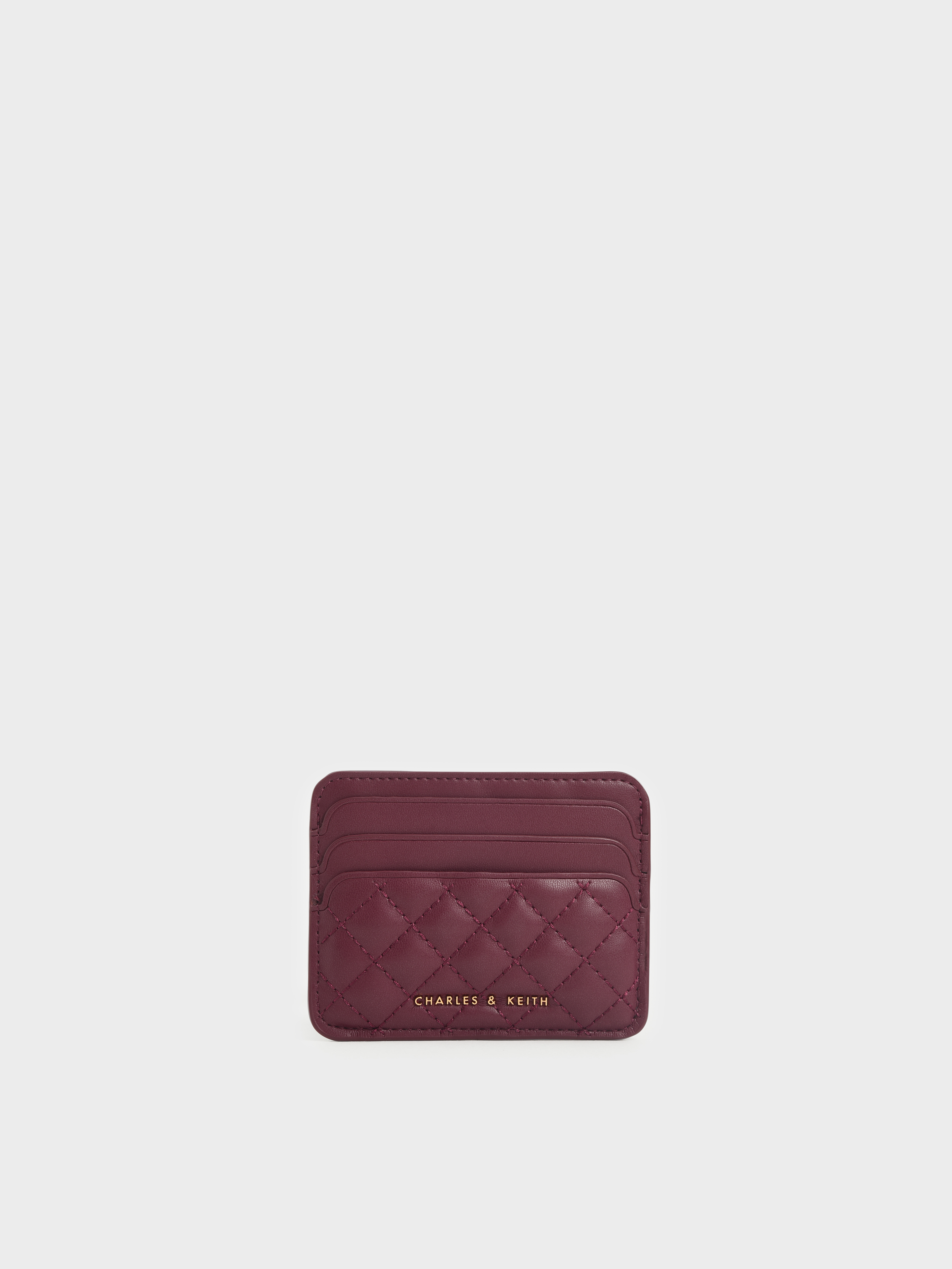Charles & Keith card holder bag in purple with gold chain strap